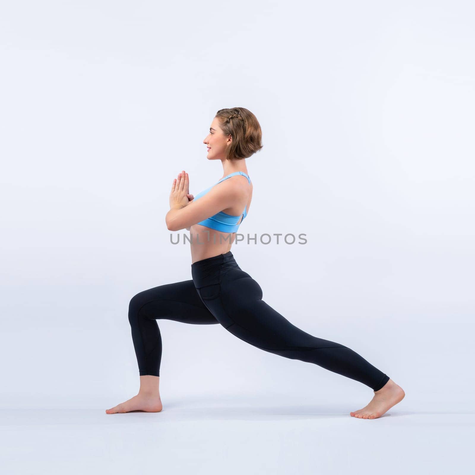 Full body length gaiety shot athletic and sporty woman doing yoga by biancoblue