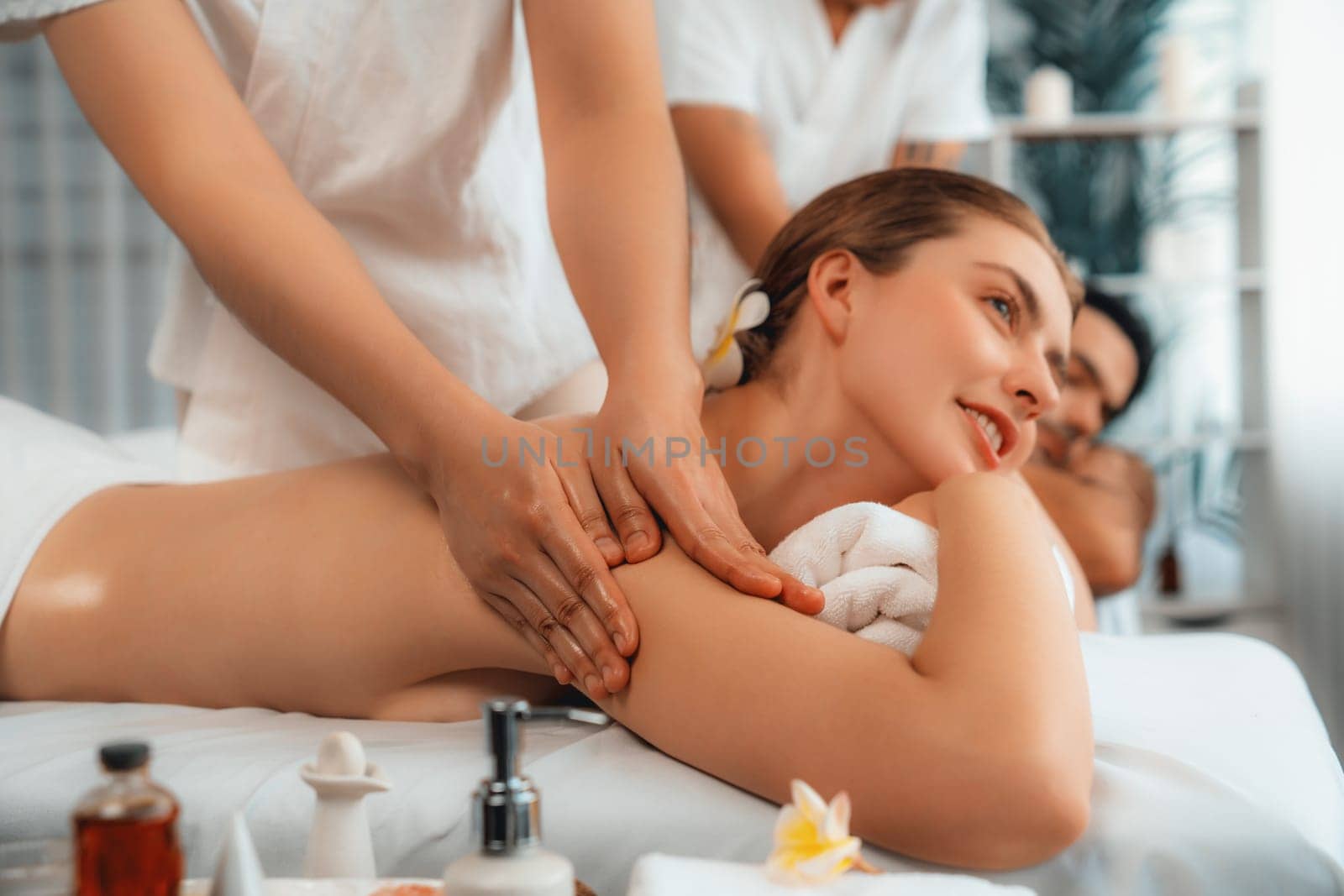 Caucasian couple customer enjoying relaxing anti-stress massage. Quiescent by biancoblue