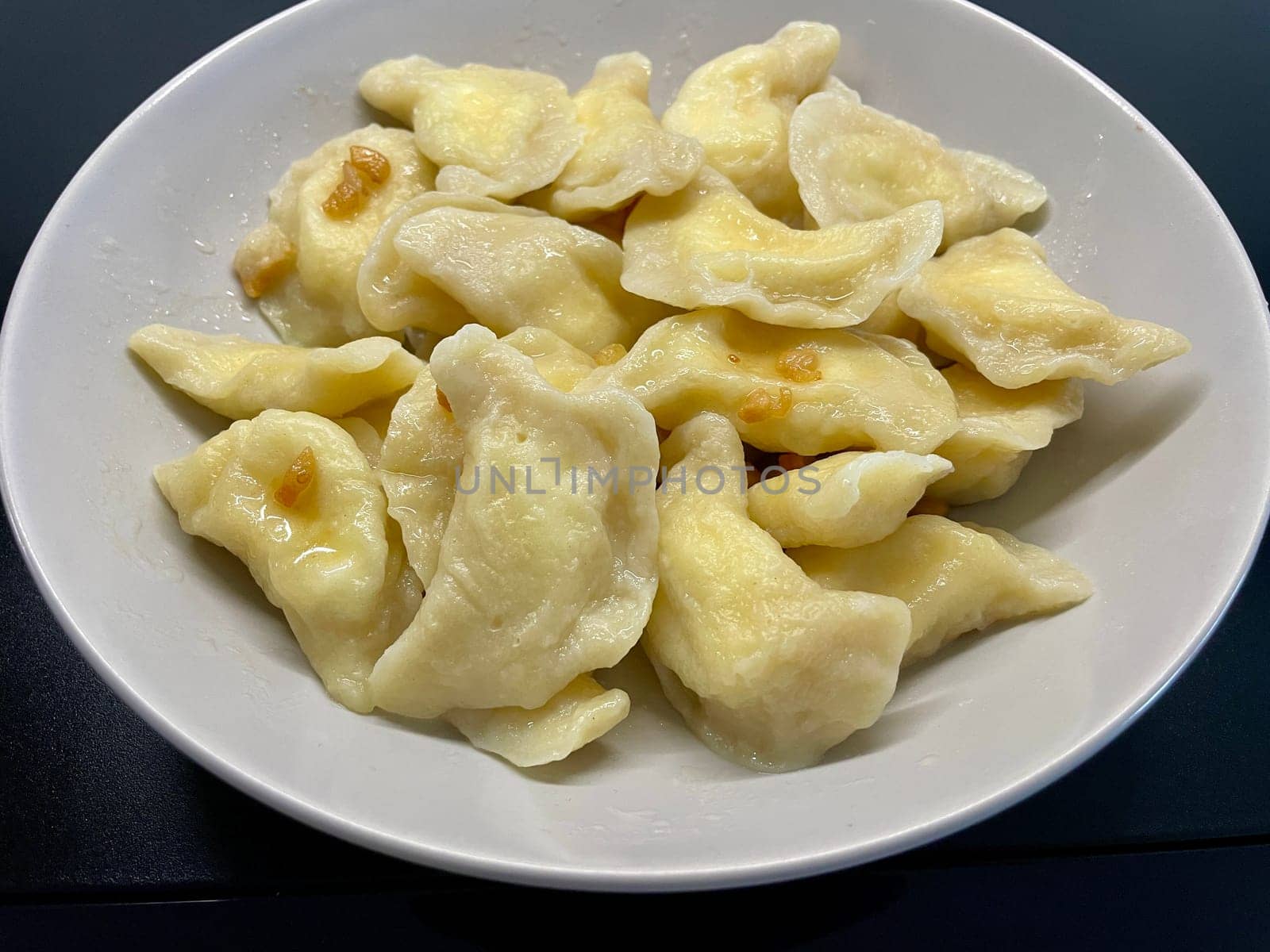 Dumplings with cheese on a gray plate. High quality photo