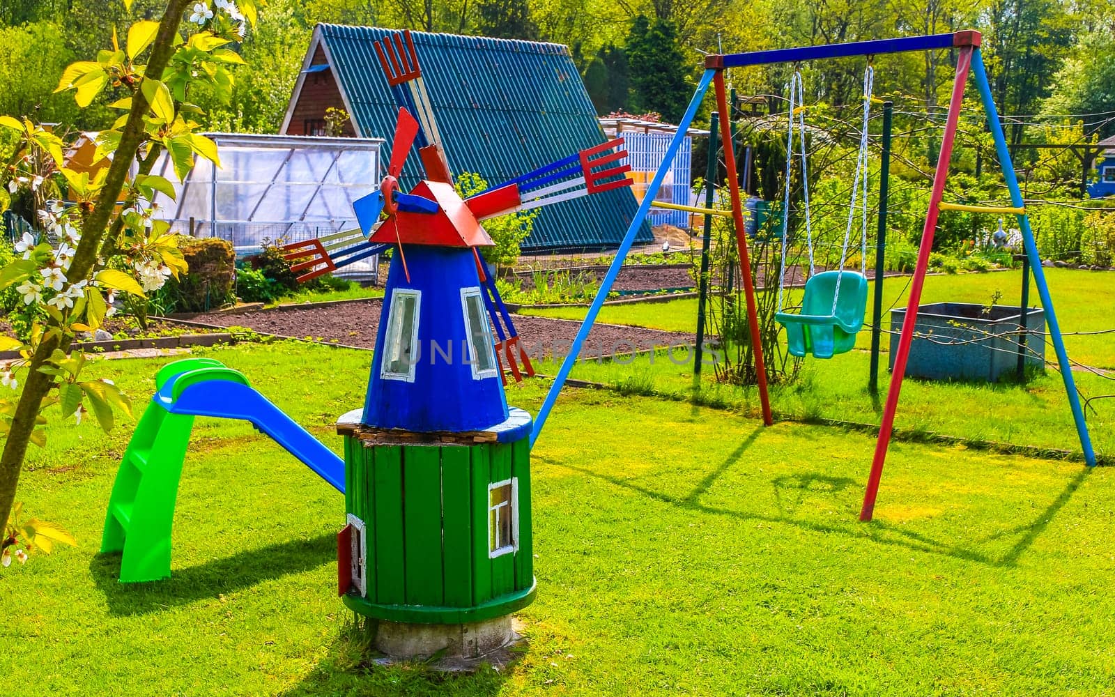 Small colorful playground in the garden in Leherheide Bremerhaven Bremen Germany.