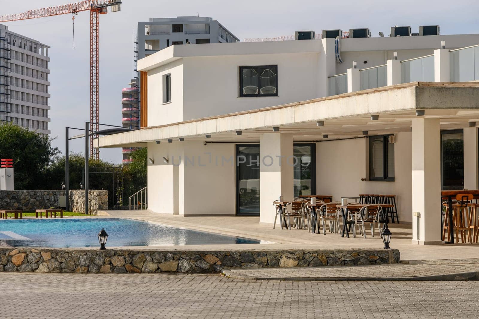 swimming pool near a cafe in a residential complex