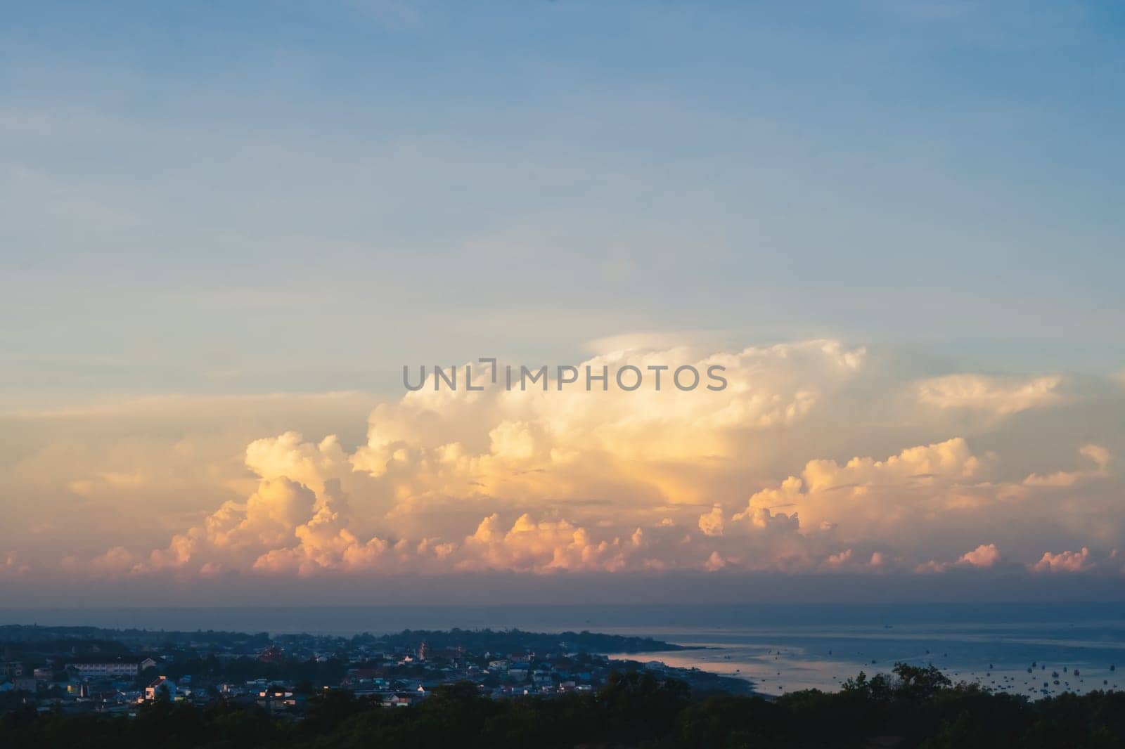 Seascape nature beauty, magic huge cumulus pink orange clouds over blue sea, freedom happiness opportunity.