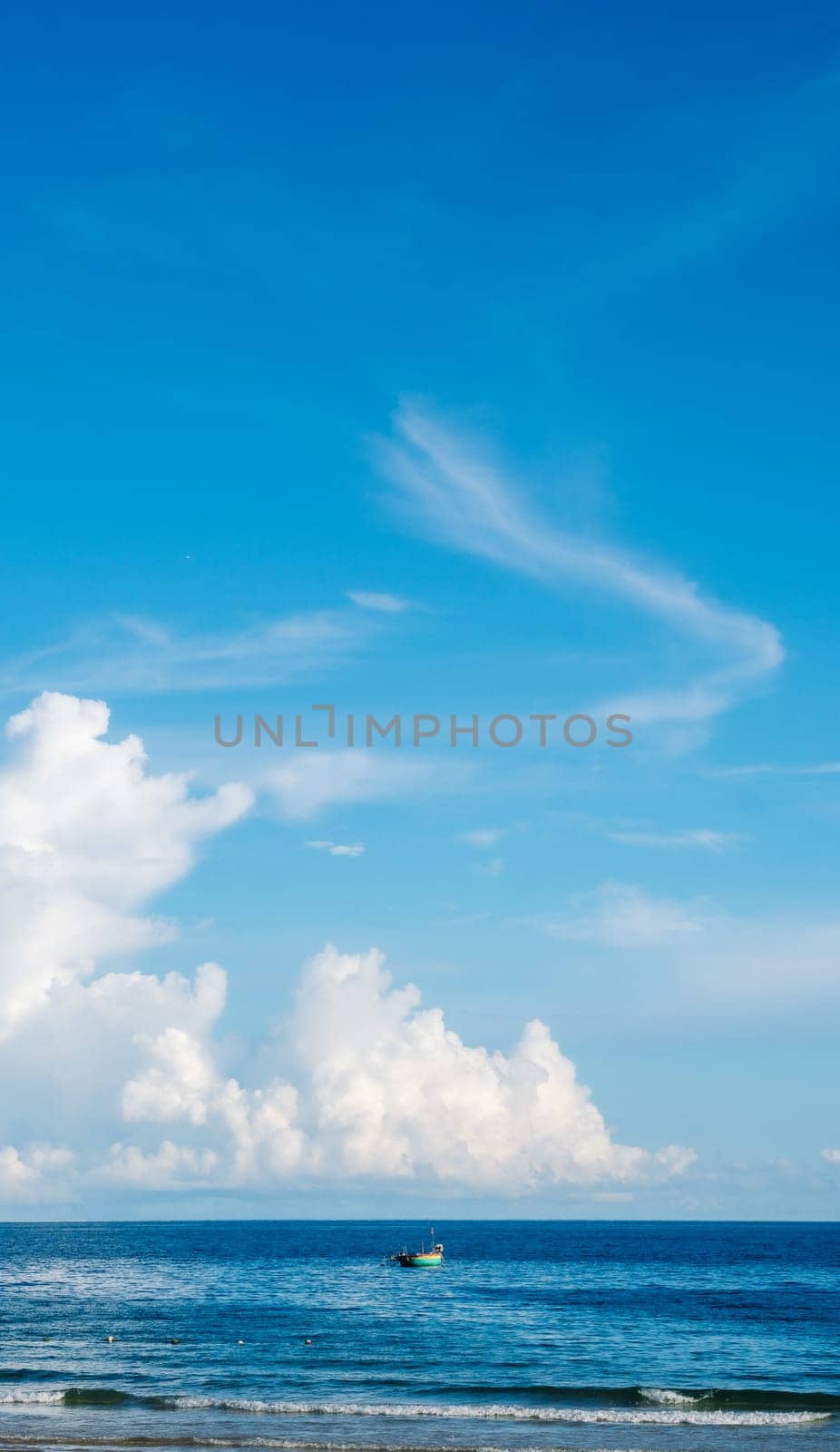 Seascape nature beauty, magic huge cumulus white clouds over blue sea, freedom happiness opportunity.
