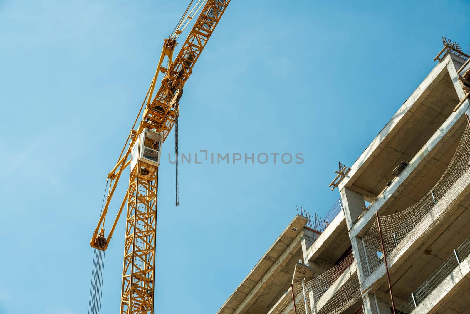 Construction crane working on large construction site