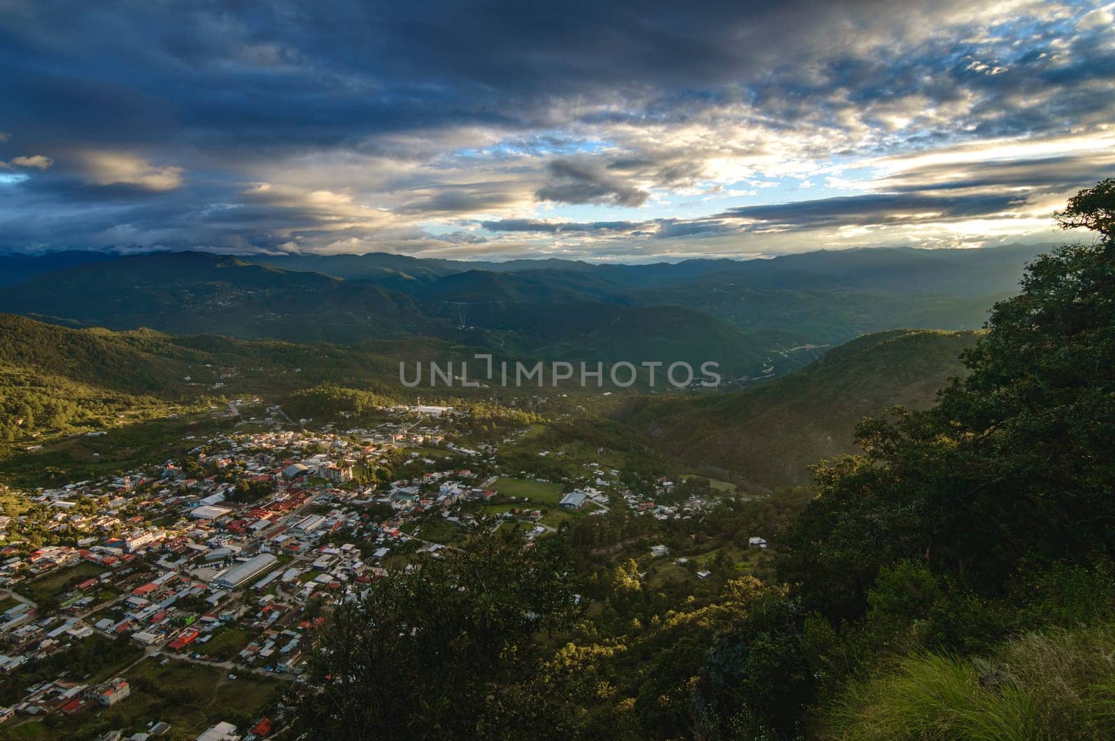 View of Ixtlan de Juarez, Oaxaca, at sunset. Beautiful small village in a valley in the Sierra de Juarez mountain range in Oaxaca, Mexico