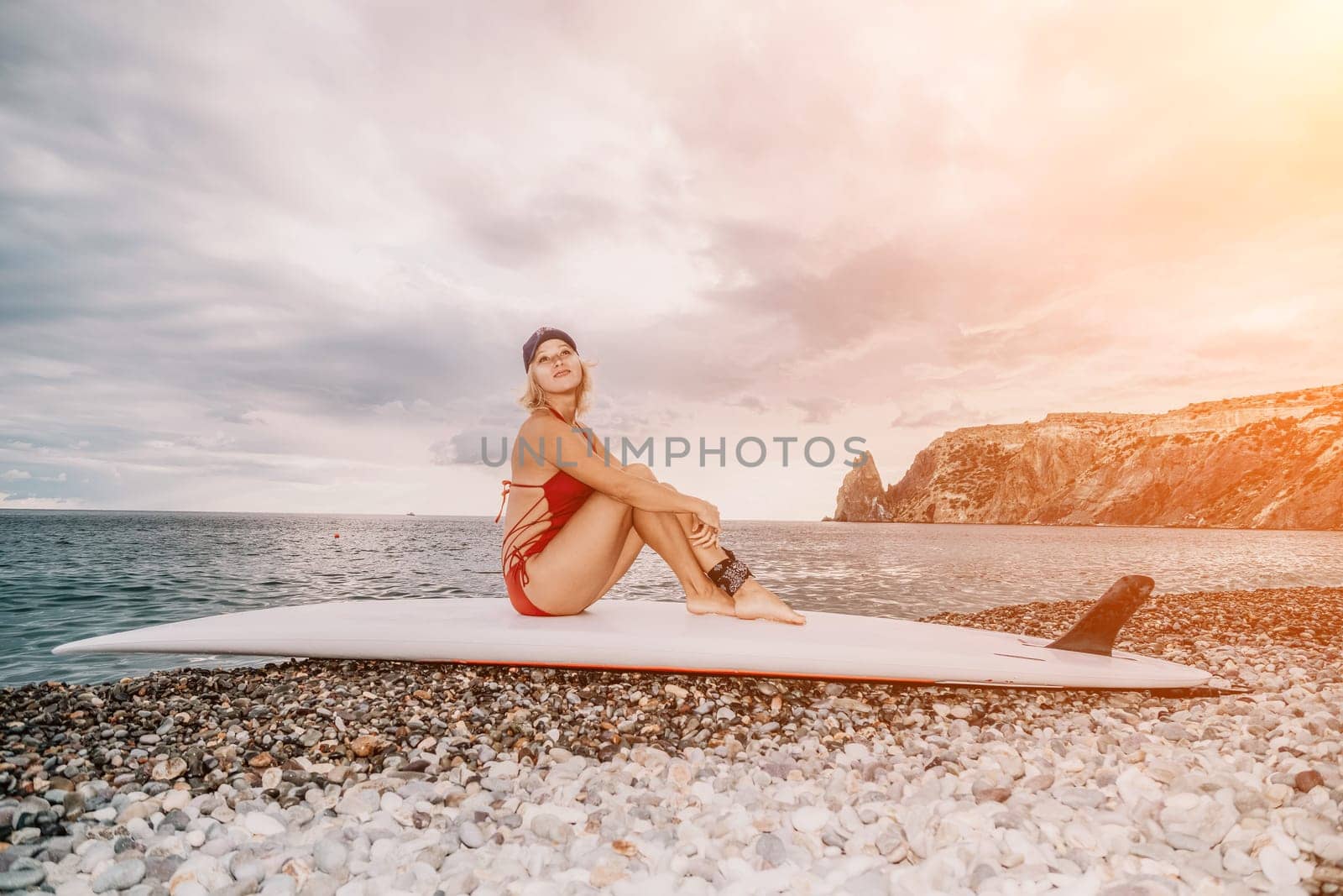 young woman in stylish bikini lying on seashore, closeup. Holiday, vacation and recreational concept.