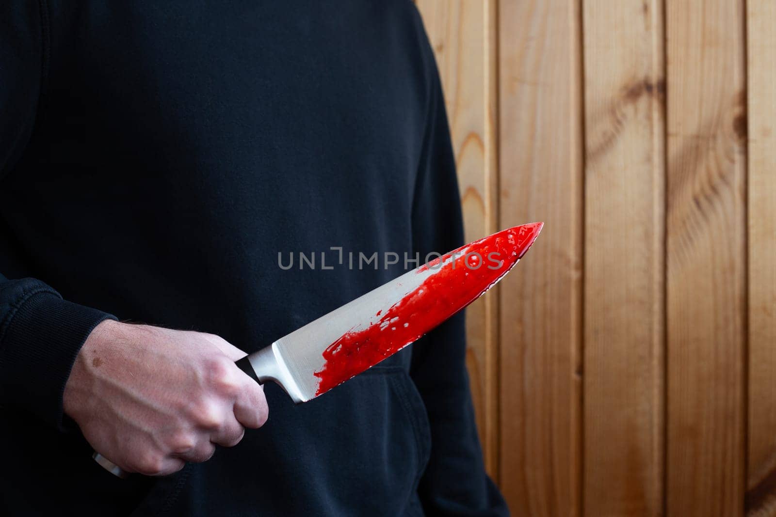 Killer holds bloody knife in hand by timurmalazoniia