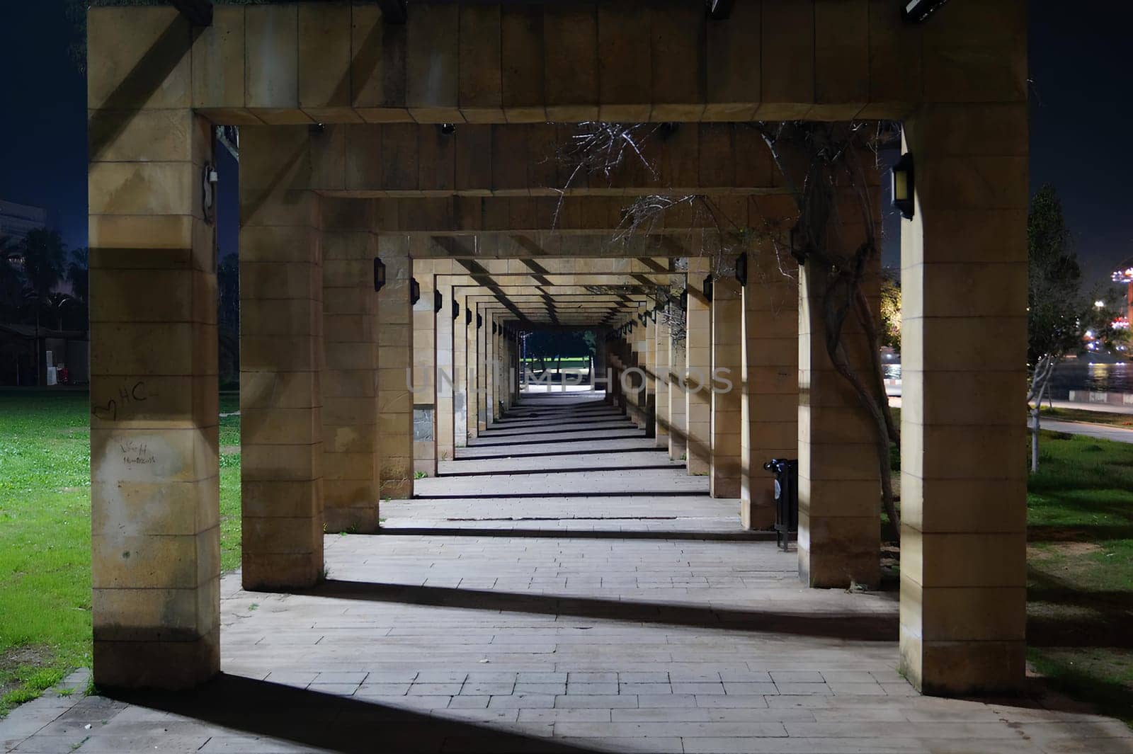 A long, empty walkway with a few lights by gadreel