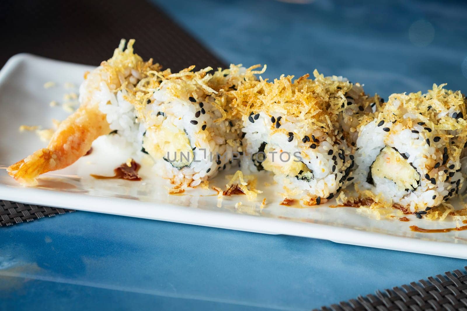 Close up view of Ebi ten roll sushi set with shrimp in tempura by Robertobinetti70