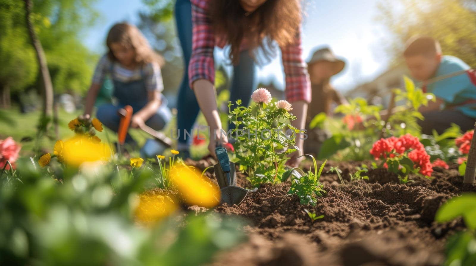 A family is picking flowers in a garden AIG41 by biancoblue