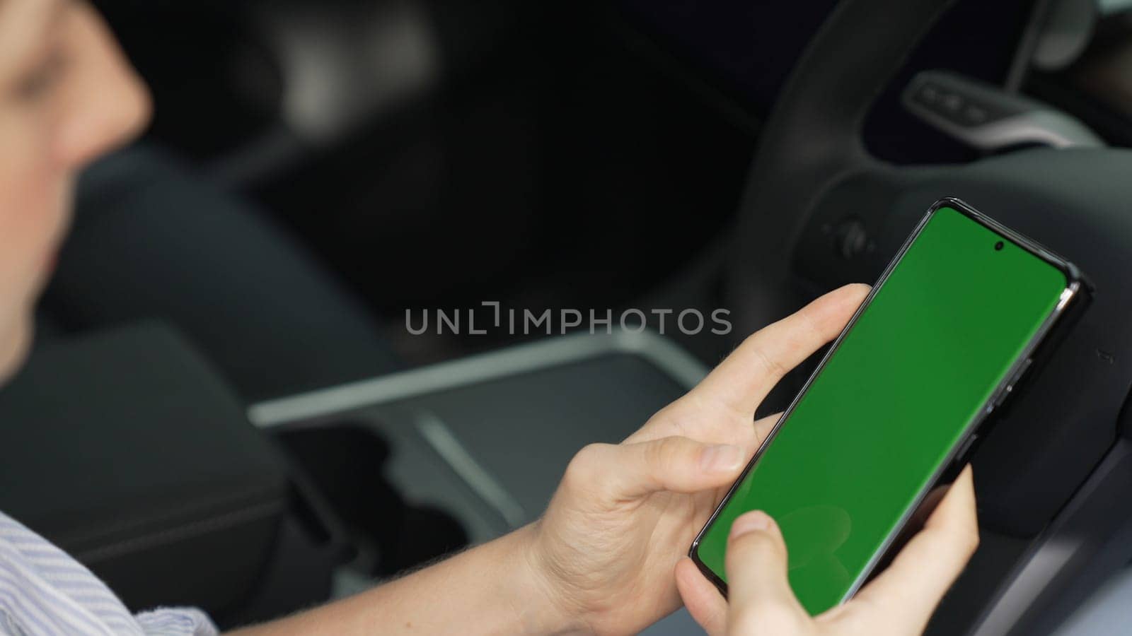 Eco-conscious woman on driver seat holding blank copyspace screen phone. Exalt by biancoblue