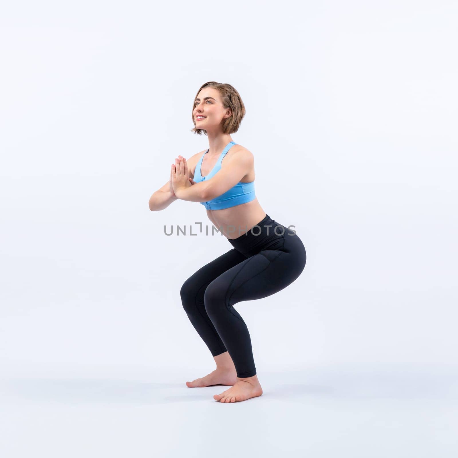 Full body length gaiety shot athletic and sporty woman doing healthy and meditative yoga exercise workout posture on isolated background. Healthy active and body care lifestyle