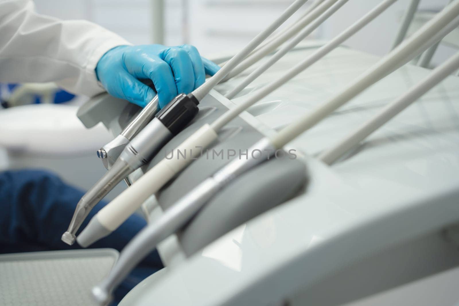 Woman smiling during her dental treatment at dentist.