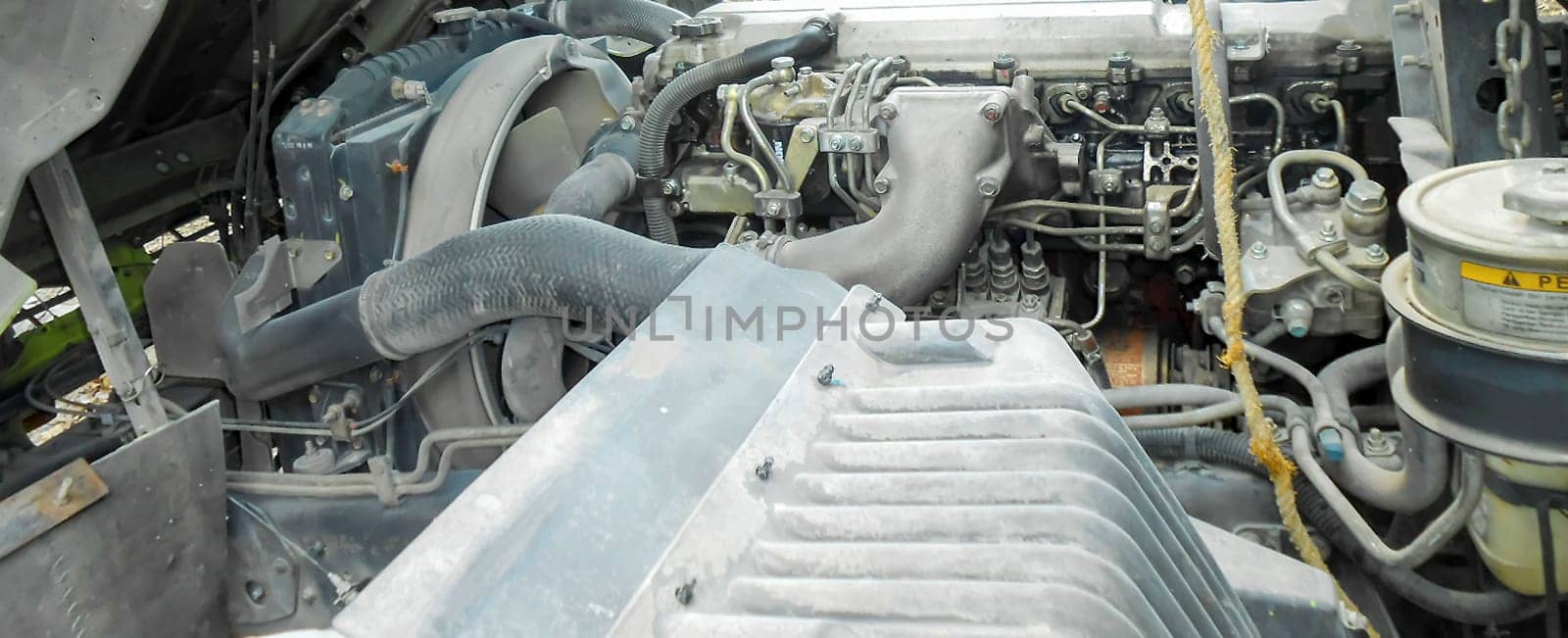 Diesel truck engine or truck engine with copy space for text. Metallic background of the internal diesel truck engine or car engine.