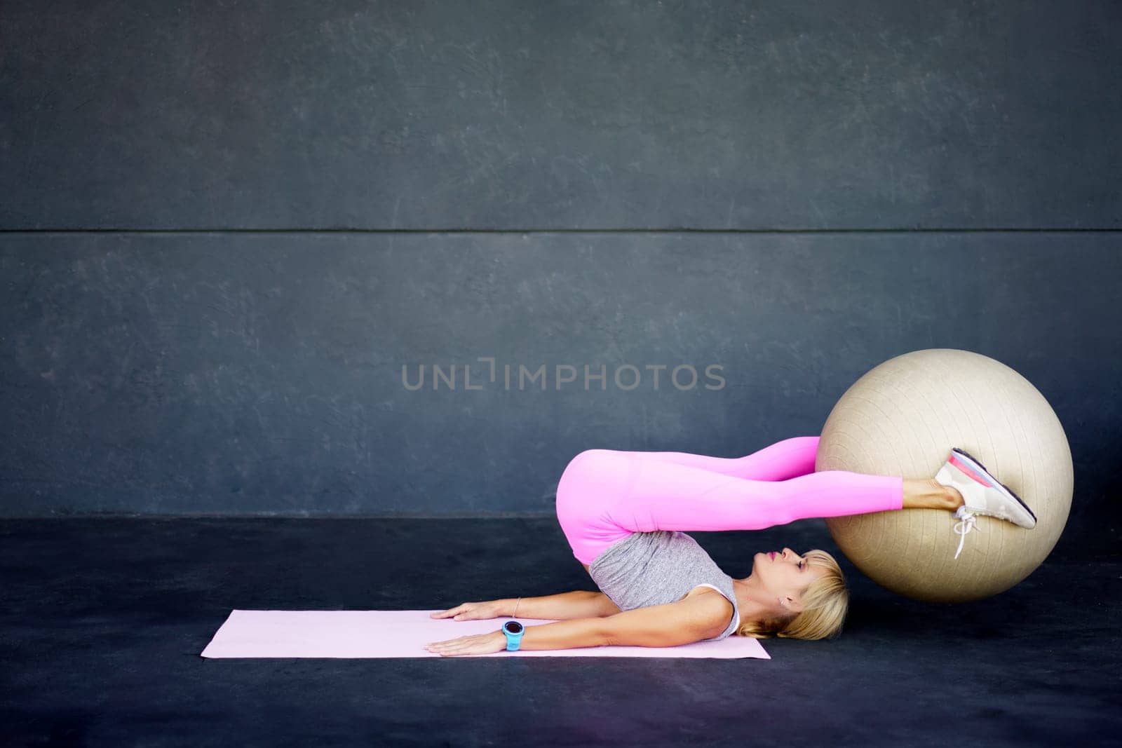 Flexible female on pilates exercise with fitness ball by javiindy