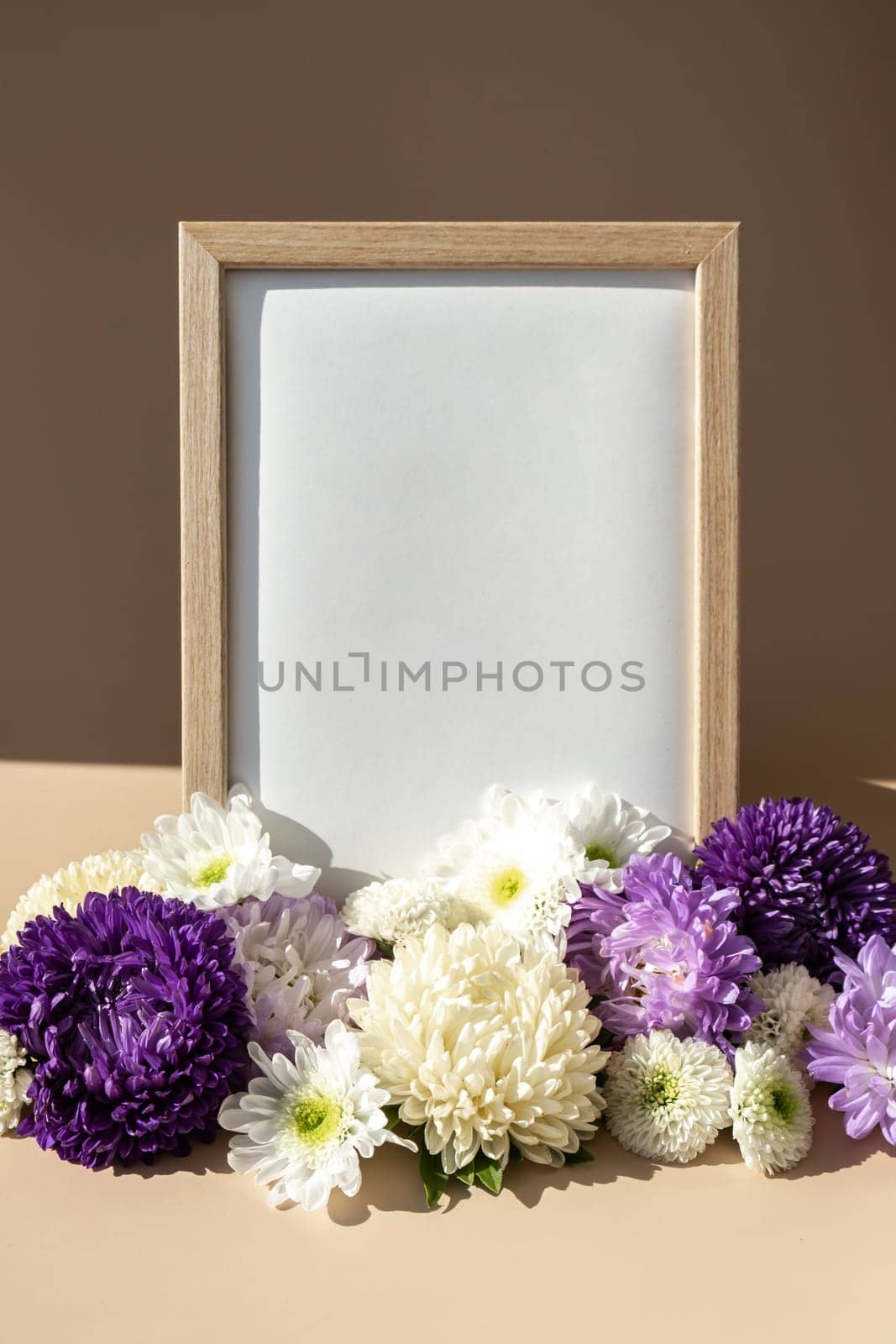 Empty paper frame with copy space for text. Mock up template. Isometric style Colorful white and violet flowers around. Holiday greeting card. Minimalistic spring concept women's day, easter, valentines