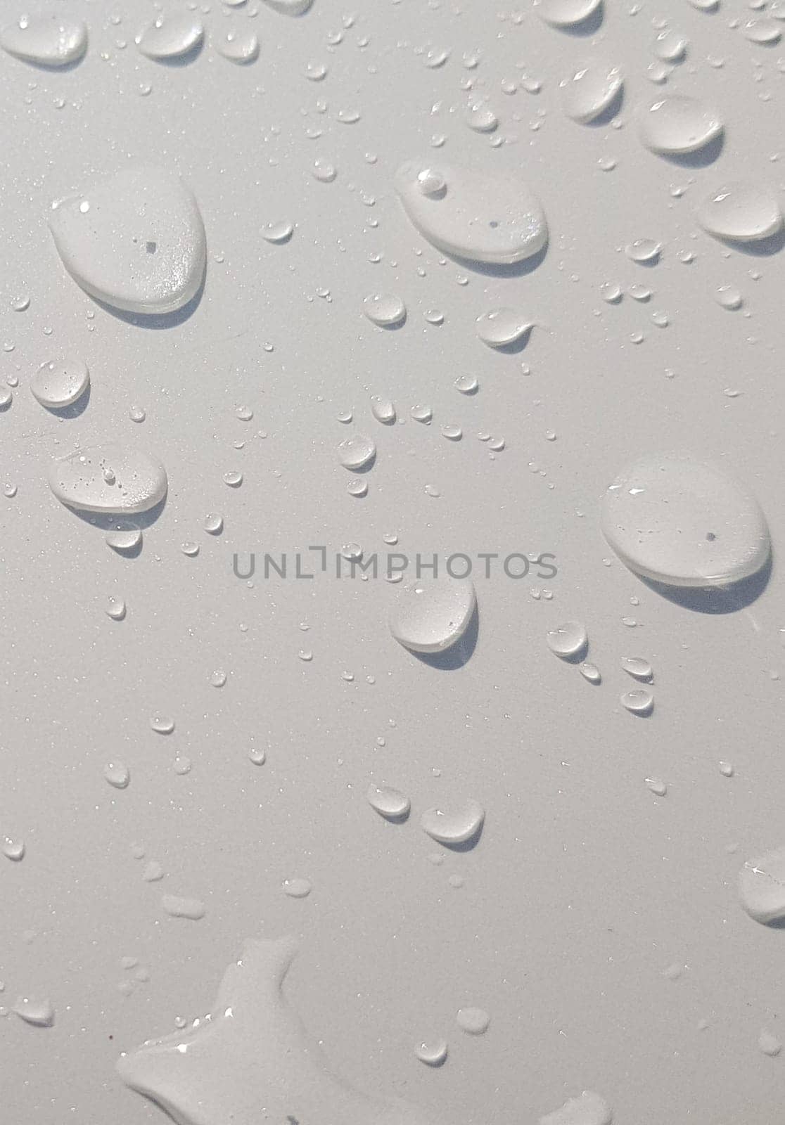 Water droplets perspective through white color surface good for multimedia content backgrounds