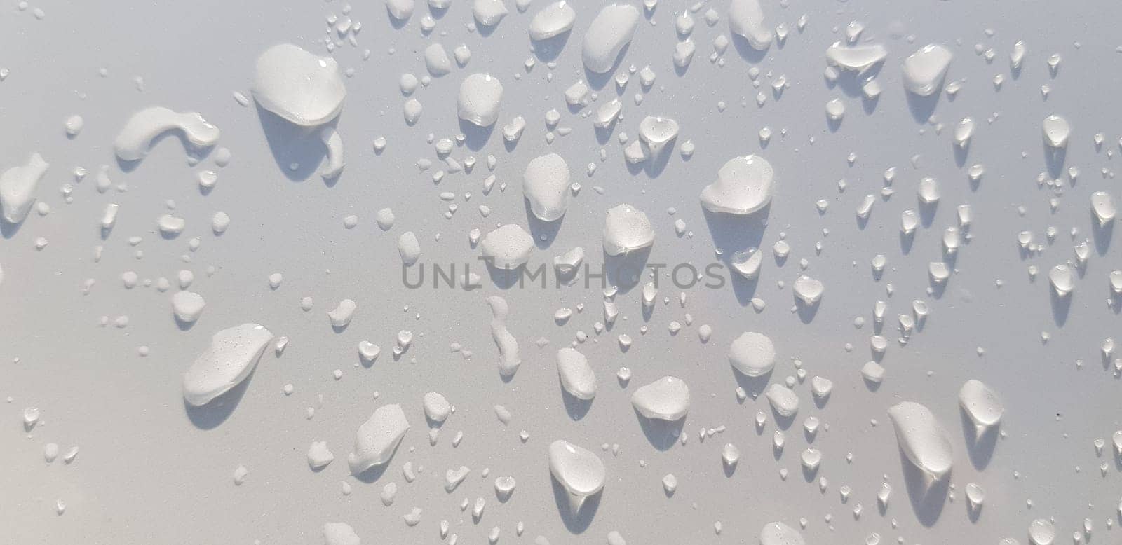 Water droplets perspective through white color surface good for multimedia content backgrounds