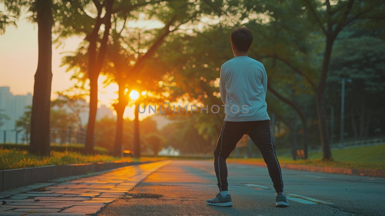 A man standing on a street with his arms outstretched