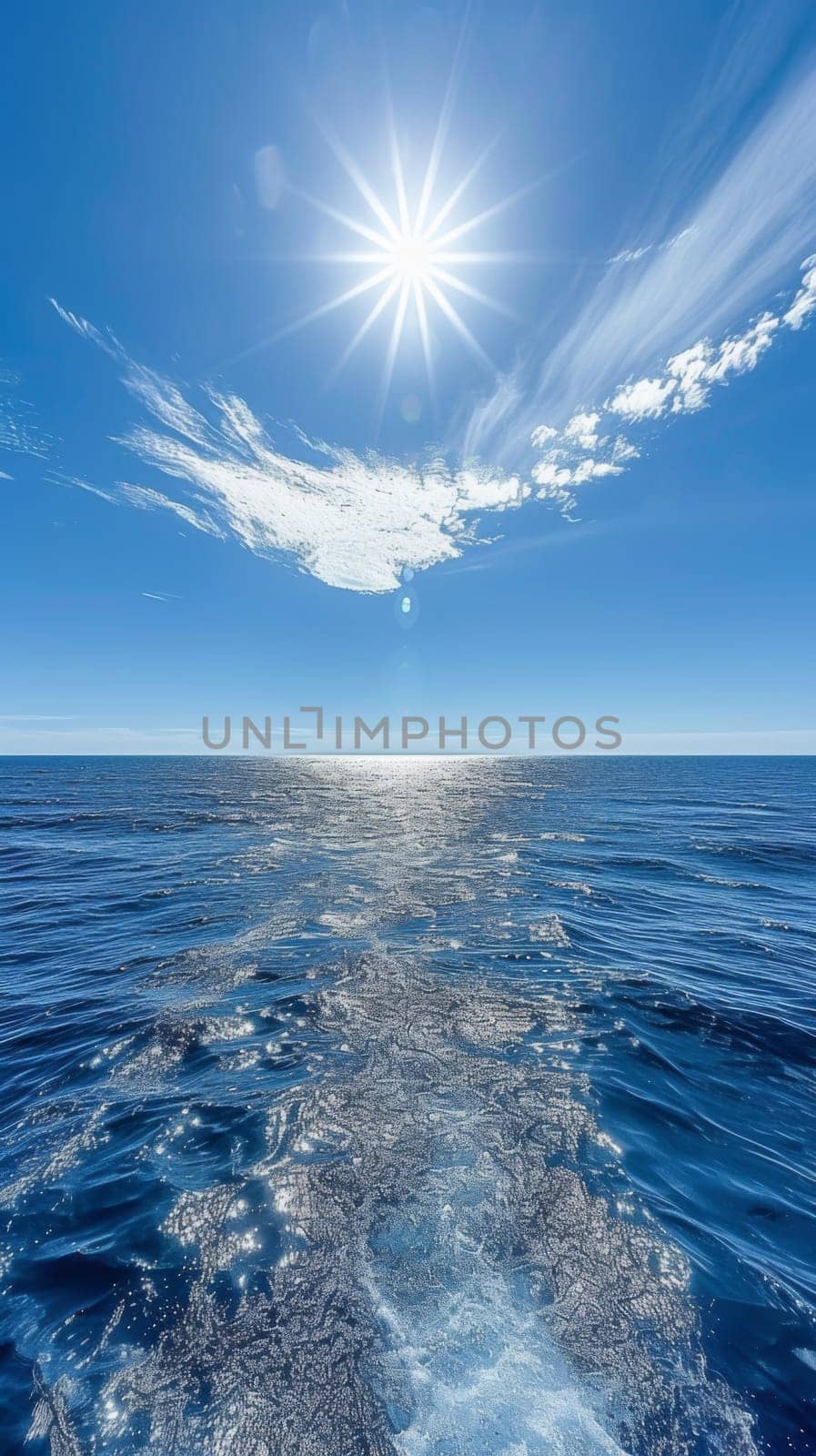 A boat traveling through the water with a bright sun in front of it