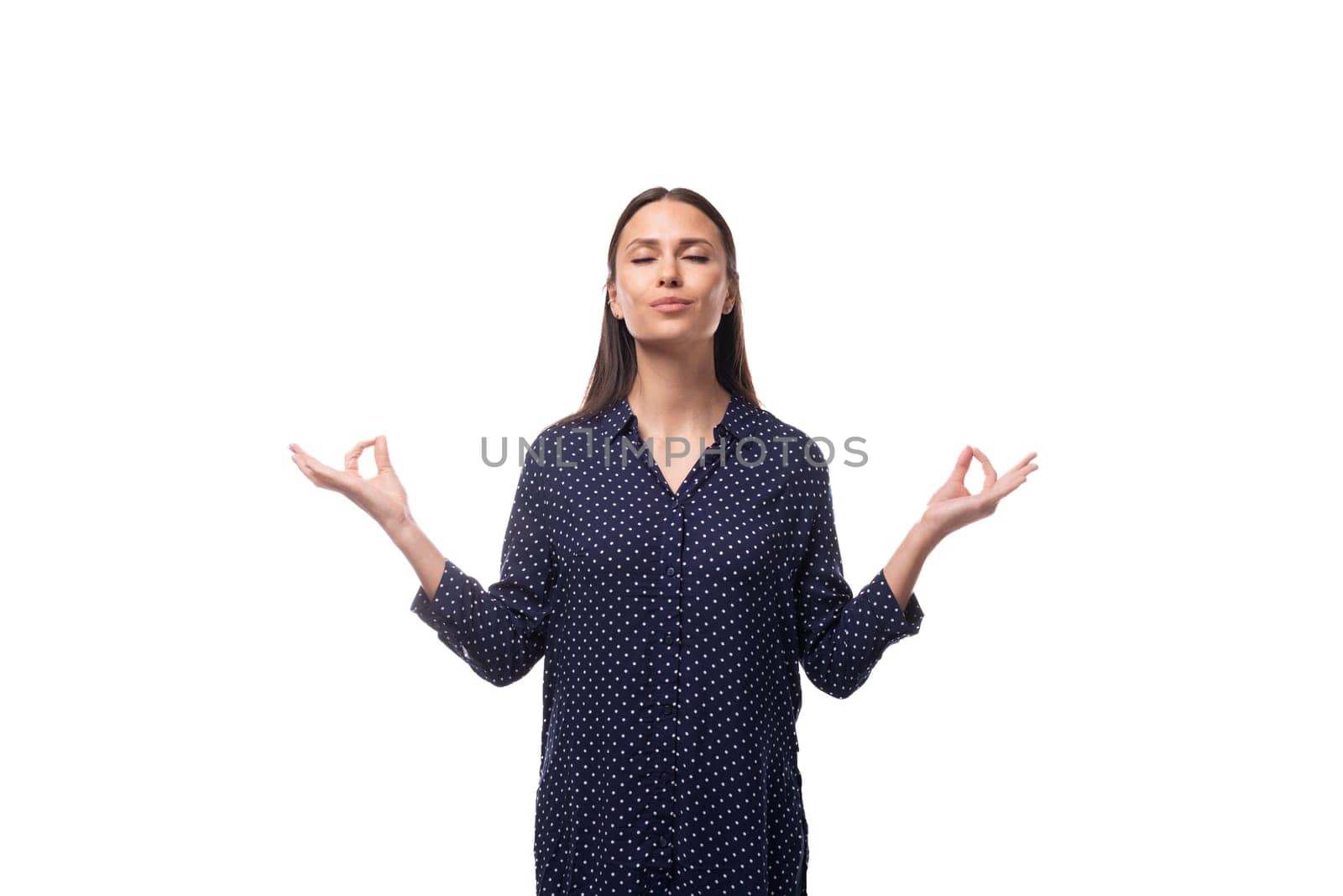 young stylish brunette woman in a blue blouse is confident.