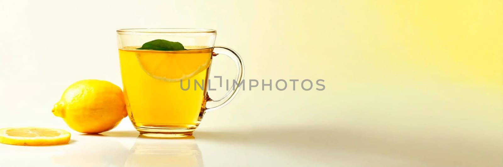 cup of tea and lemon on the table. Selective focus. by yanadjana