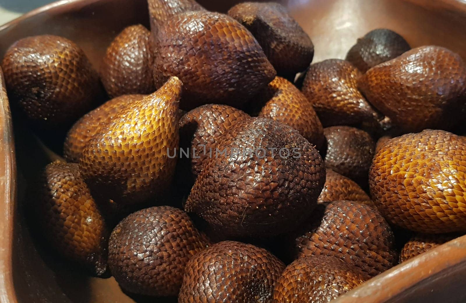 group of snake fruit or called salak in local indonesian language is a type of palm fruit commonly eaten also known as sala, the scientific name is Salacca zalacca.