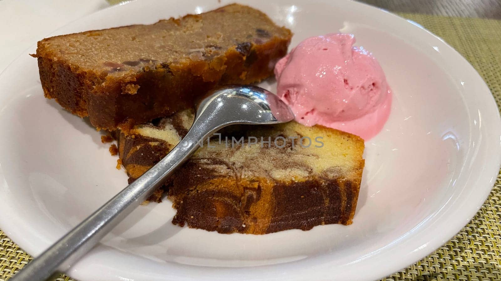 Fresh fruit cake and marble pound cake with strawberry ice cream on white plate for your multimedia backgrounds