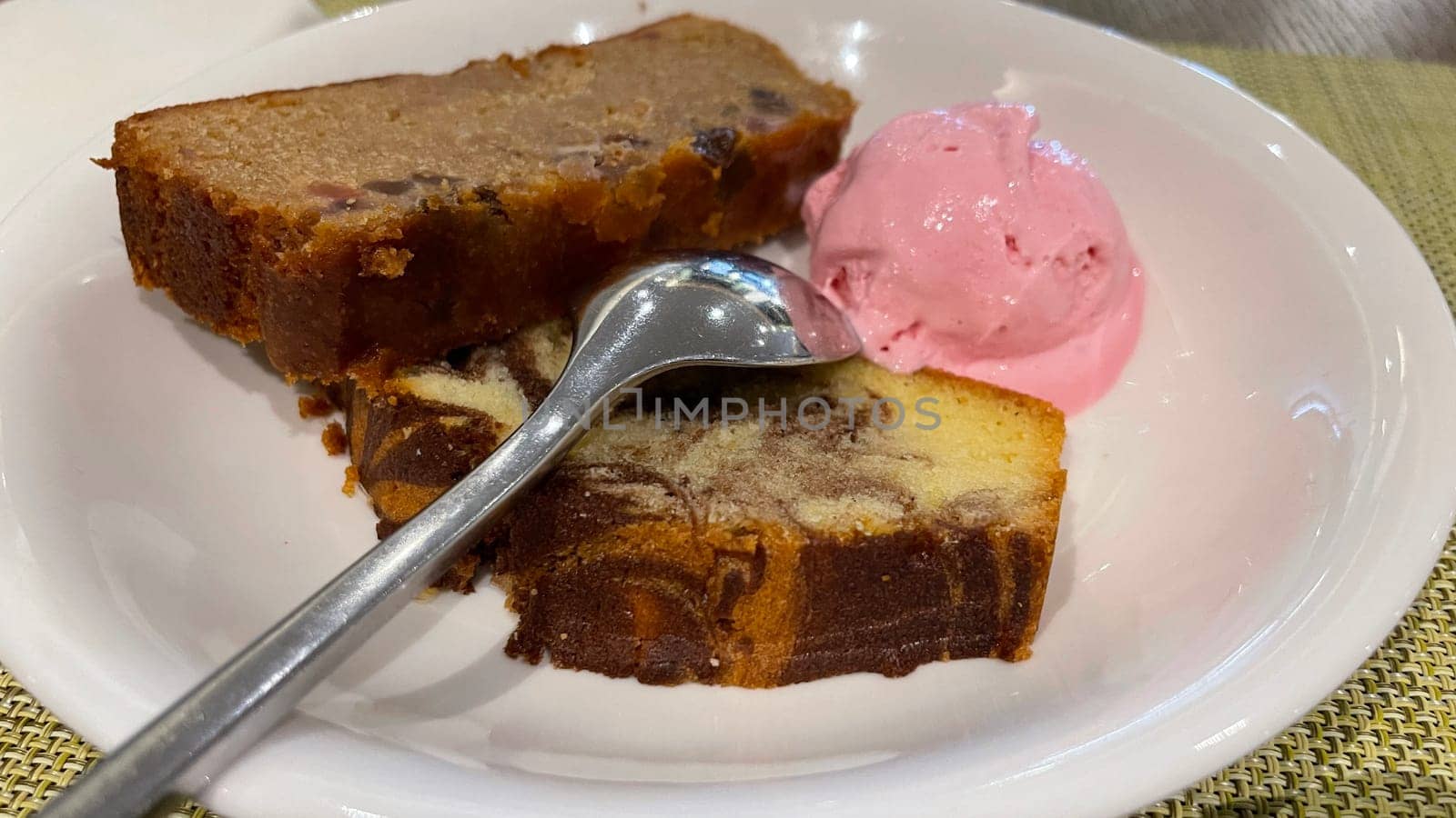Fresh fruit cake and marble pound cake with strawberry ice cream on white plate for your multimedia backgrounds