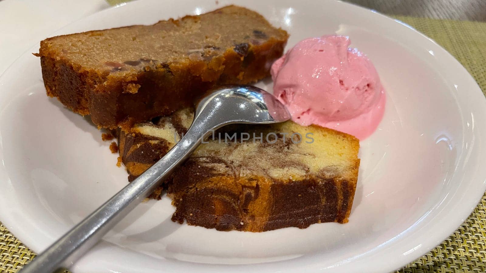 Fresh fruit cake and marble pound cake with strawberry ice cream on white plate for your multimedia backgrounds