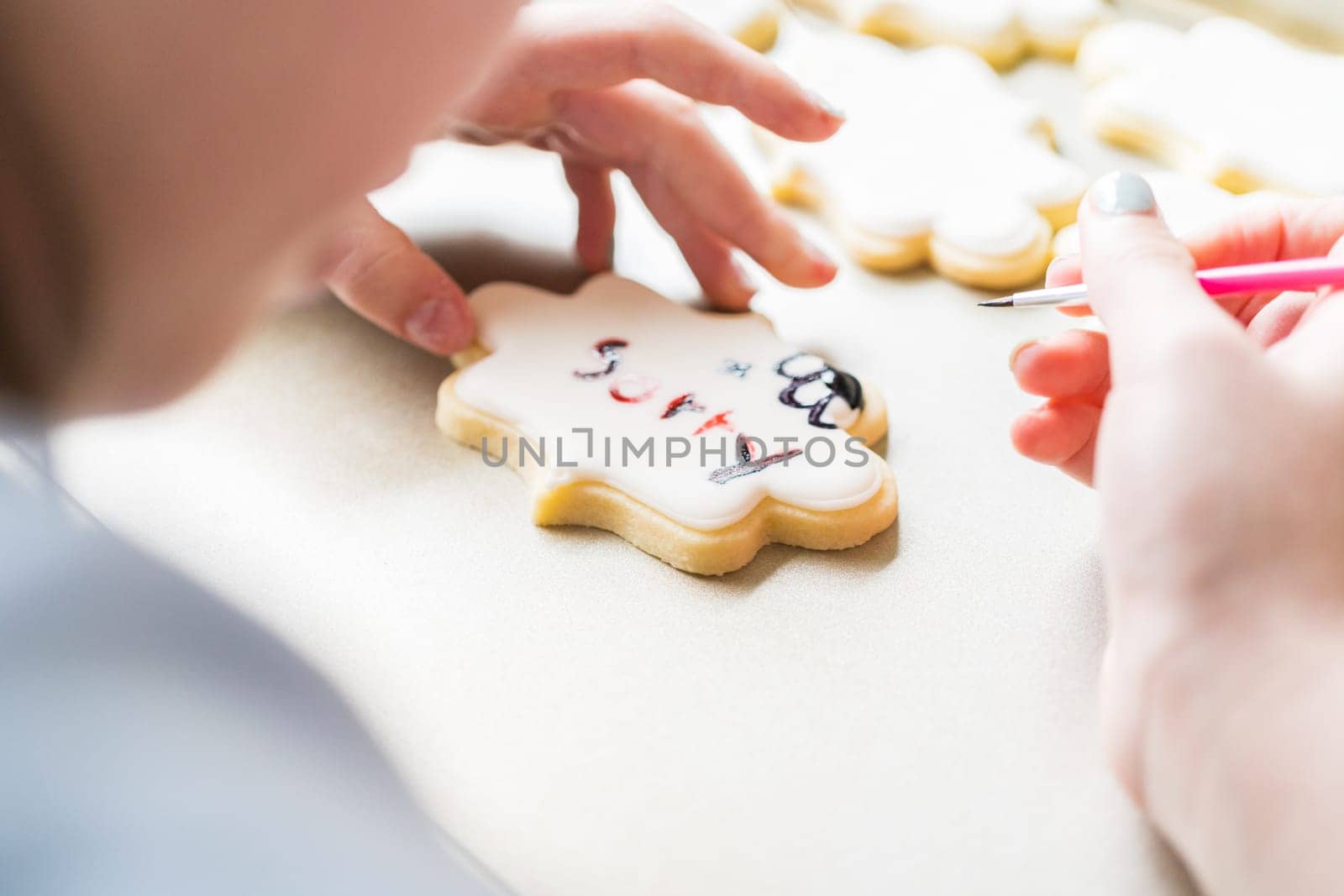 Little Girl Spells 'Sorry' on Iced Sugar Cookies by arinahabich