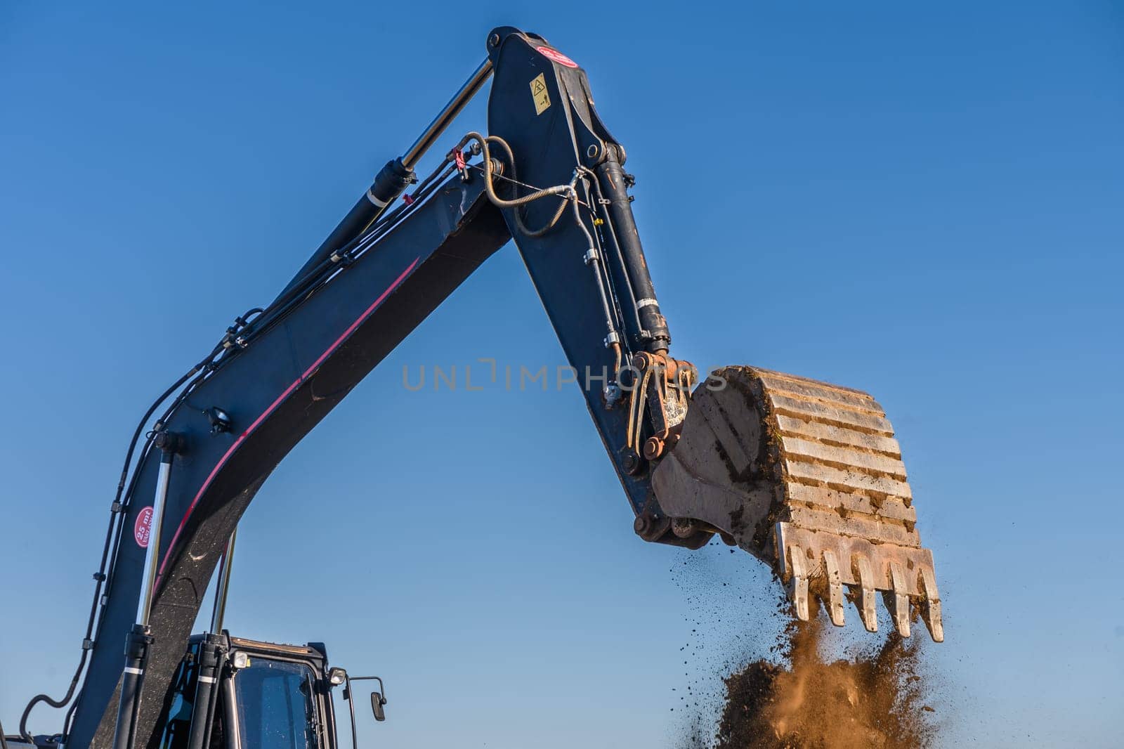 Close up details of industrial excavator working on construction site 2