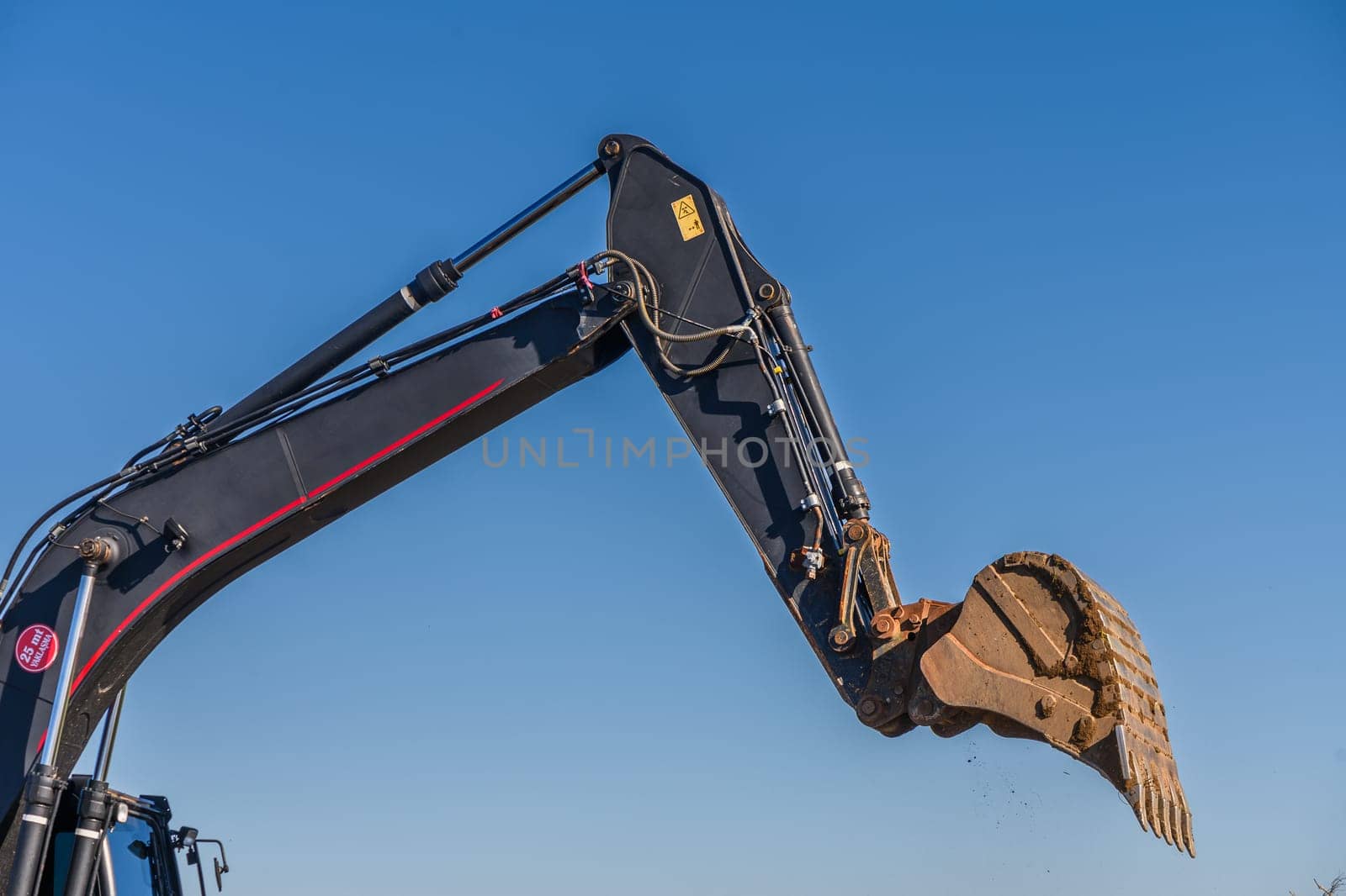 Close up details of industrial excavator working on construction site 4