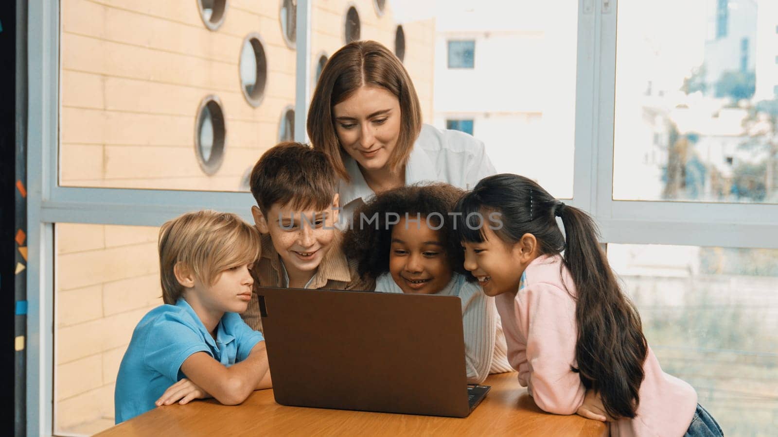 Cute african girl programing system while surround with caucasian teacher and diverse friend. Professional instructor explain and teaching coding engineering prompt while student listening. Erudition.