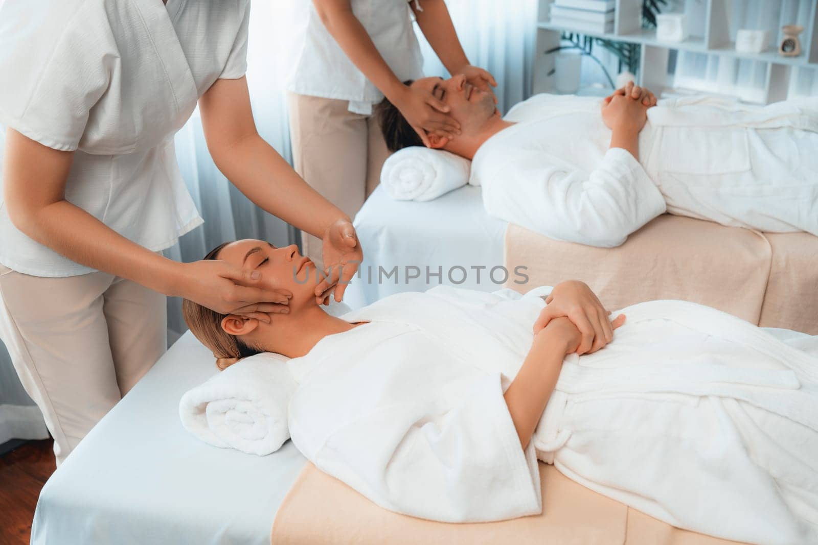 Caucasian couple enjoying relaxing anti-stress head massage. Quiescent by biancoblue