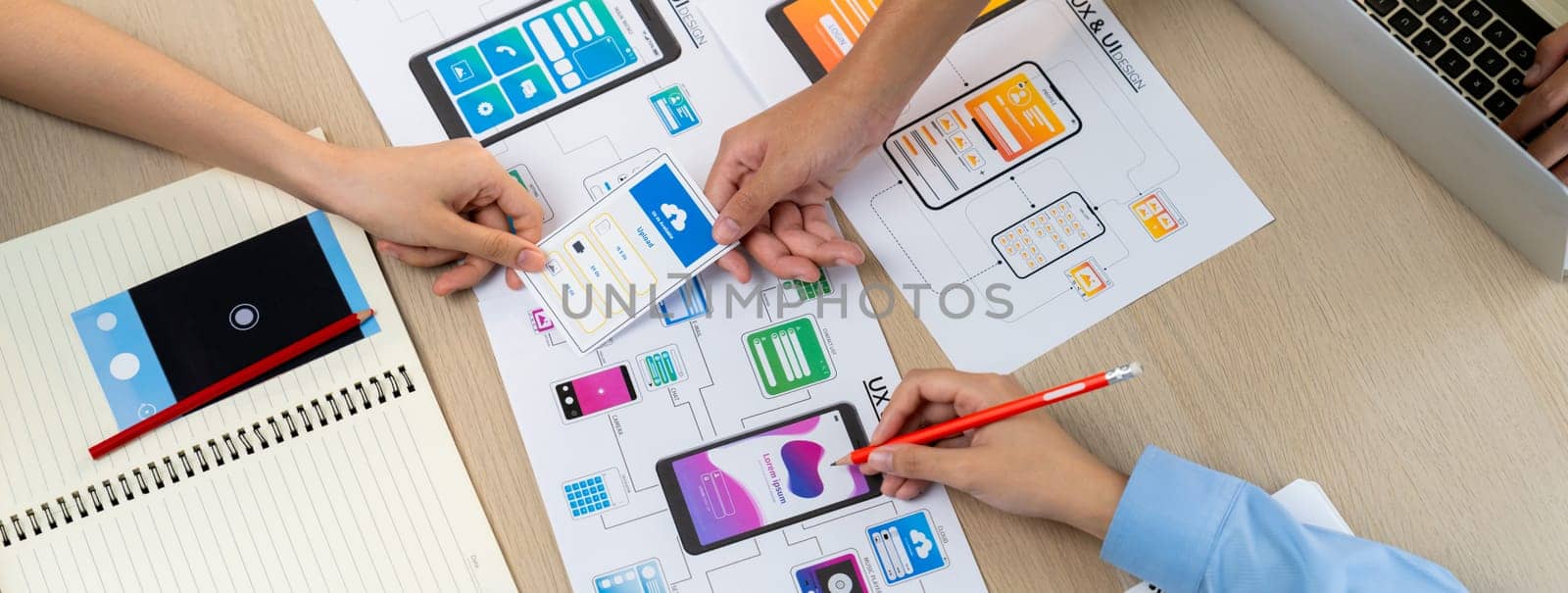 Panorama banner of startup company employee planning on user interface prototype for mobile application or website in office. UX UI designer brainstorm user friendly interface plan. Synergic