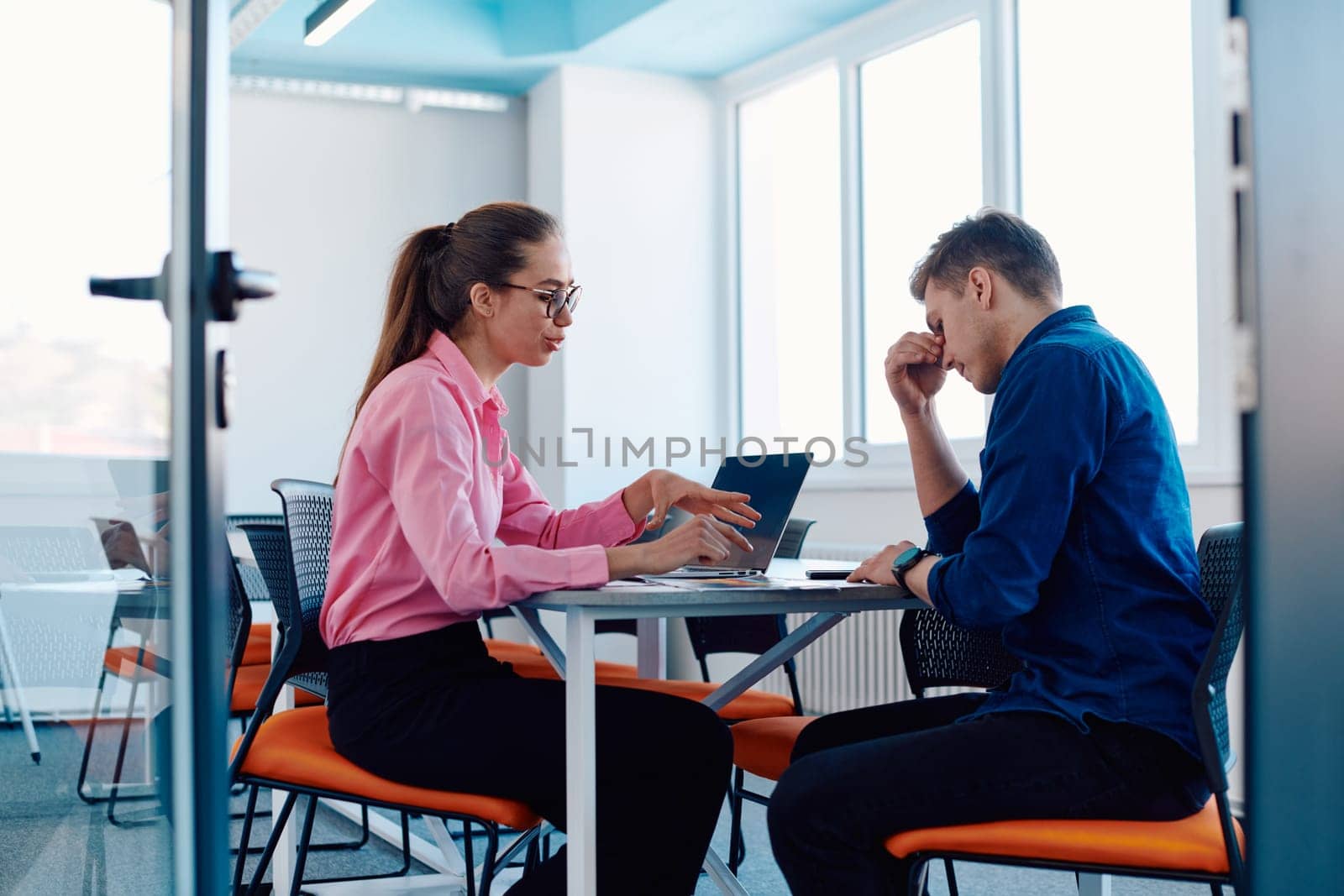 A furious business director of a startup office berating her employee for business mistakes and errors.