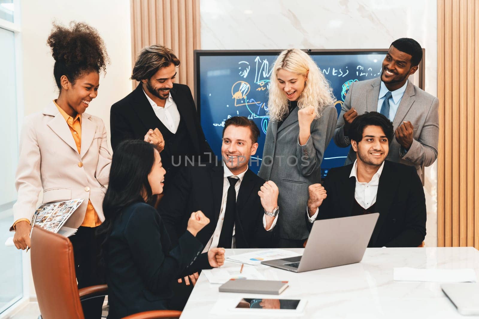 Multicultural businesspeople brainstorming business idea together. Diverse professional business team working together, sharing, planing idea, strategy. Meeting room, laptop, presentation. Ornamented.