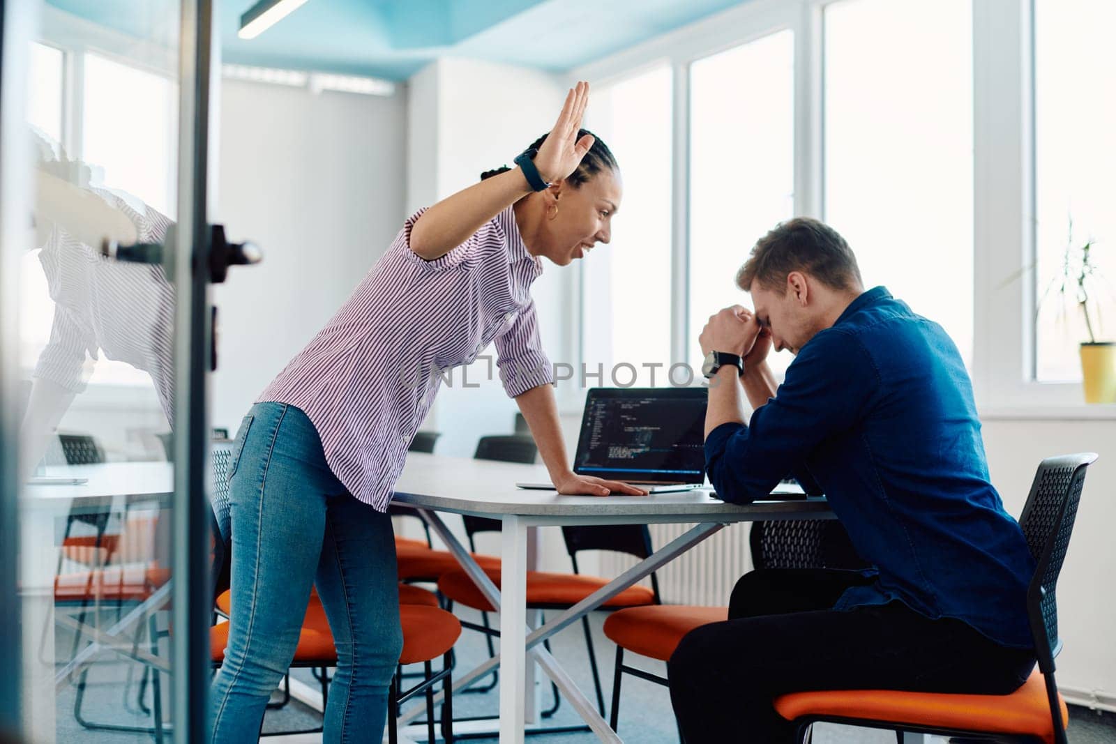 A furious business director of a startup office berating her employee for business mistakes and errors.