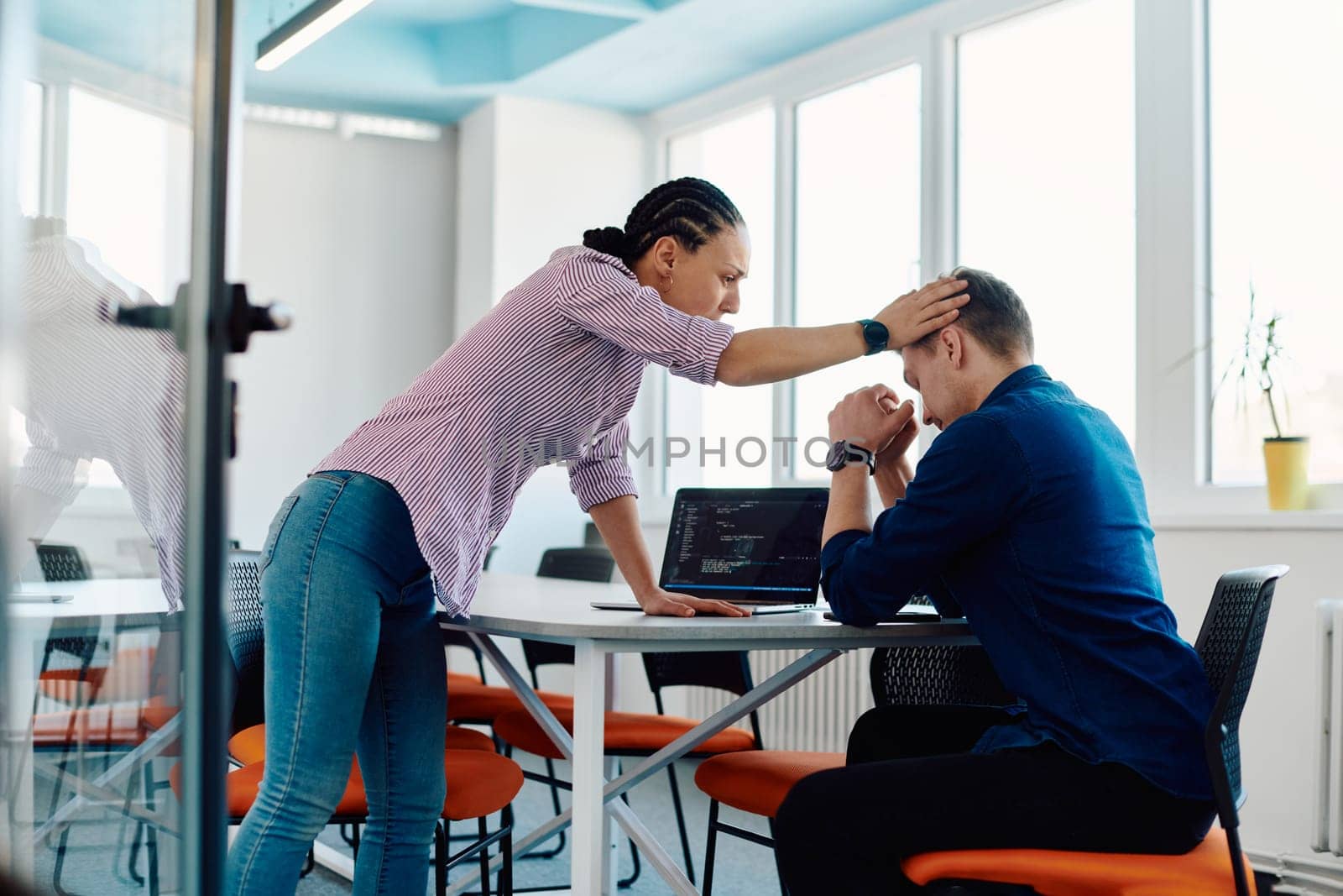 A furious business director of a startup office berating her employee for business mistakes and errors.