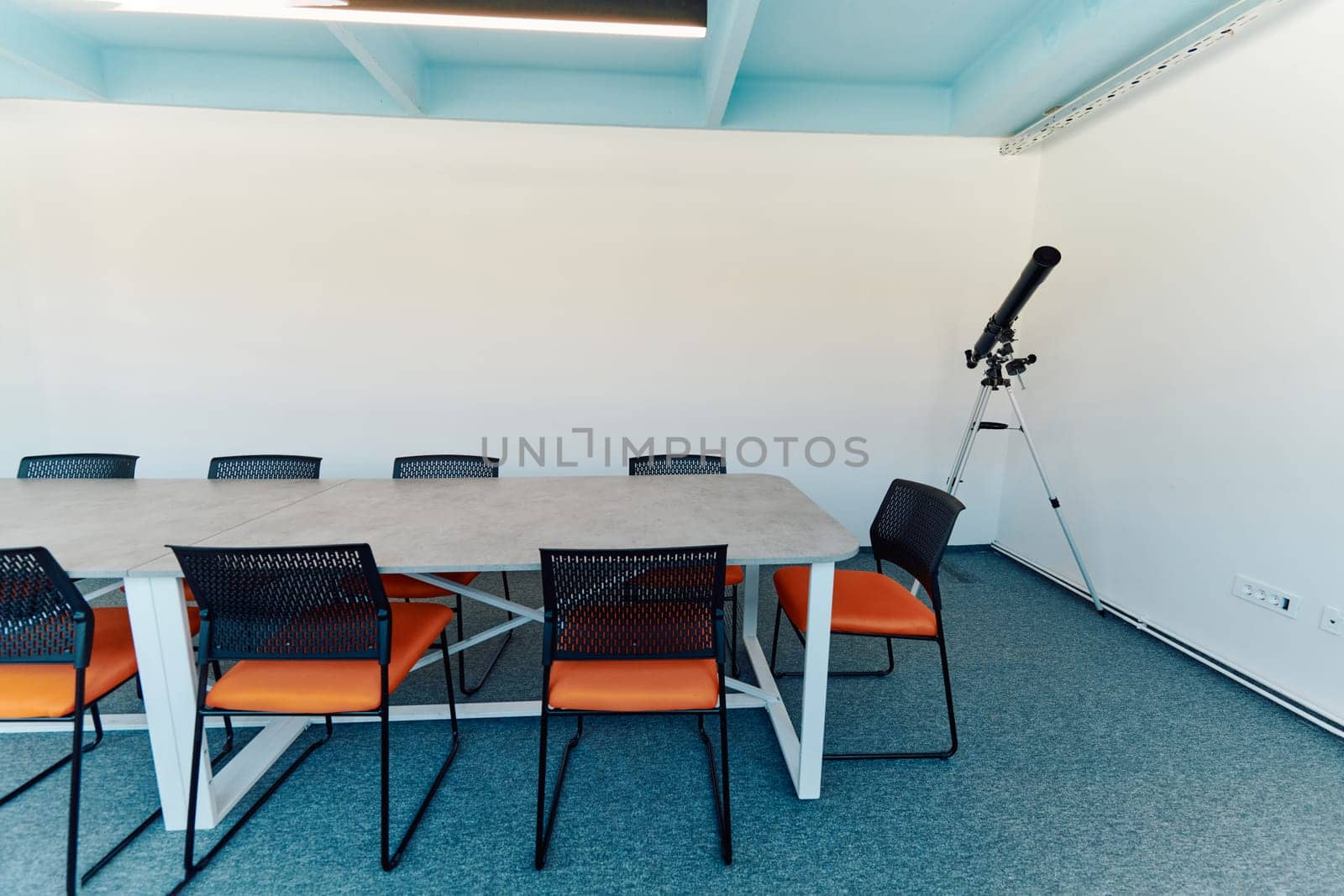 Photo of a modern office where programming, digital marketing and web design projects are done. Office with modern furniture and glass office.