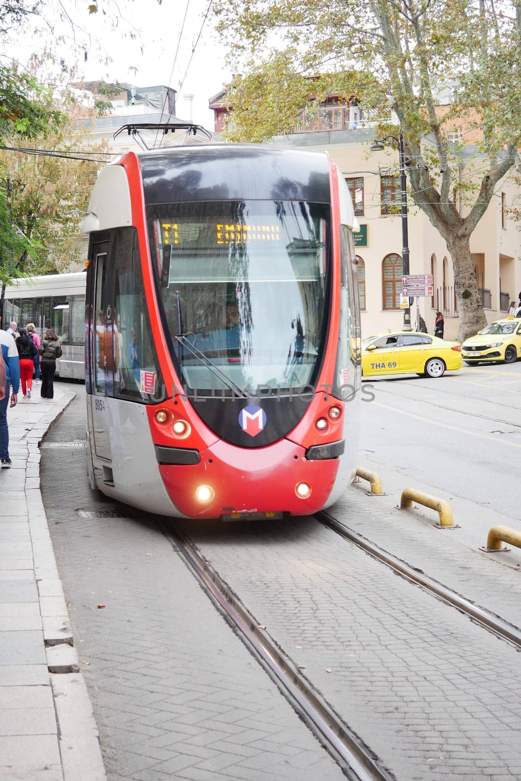 turkey istanbul 1 june 2023. T1 tram at Eminonu with people crossing the road ,