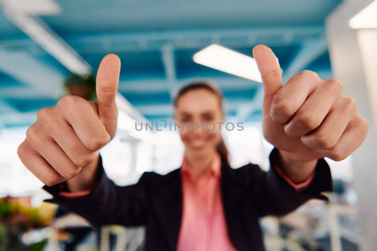 Closeup of hands, Smiling Business Woman Making Frame Gesture with at modern bright coworking open space startup office by dotshock