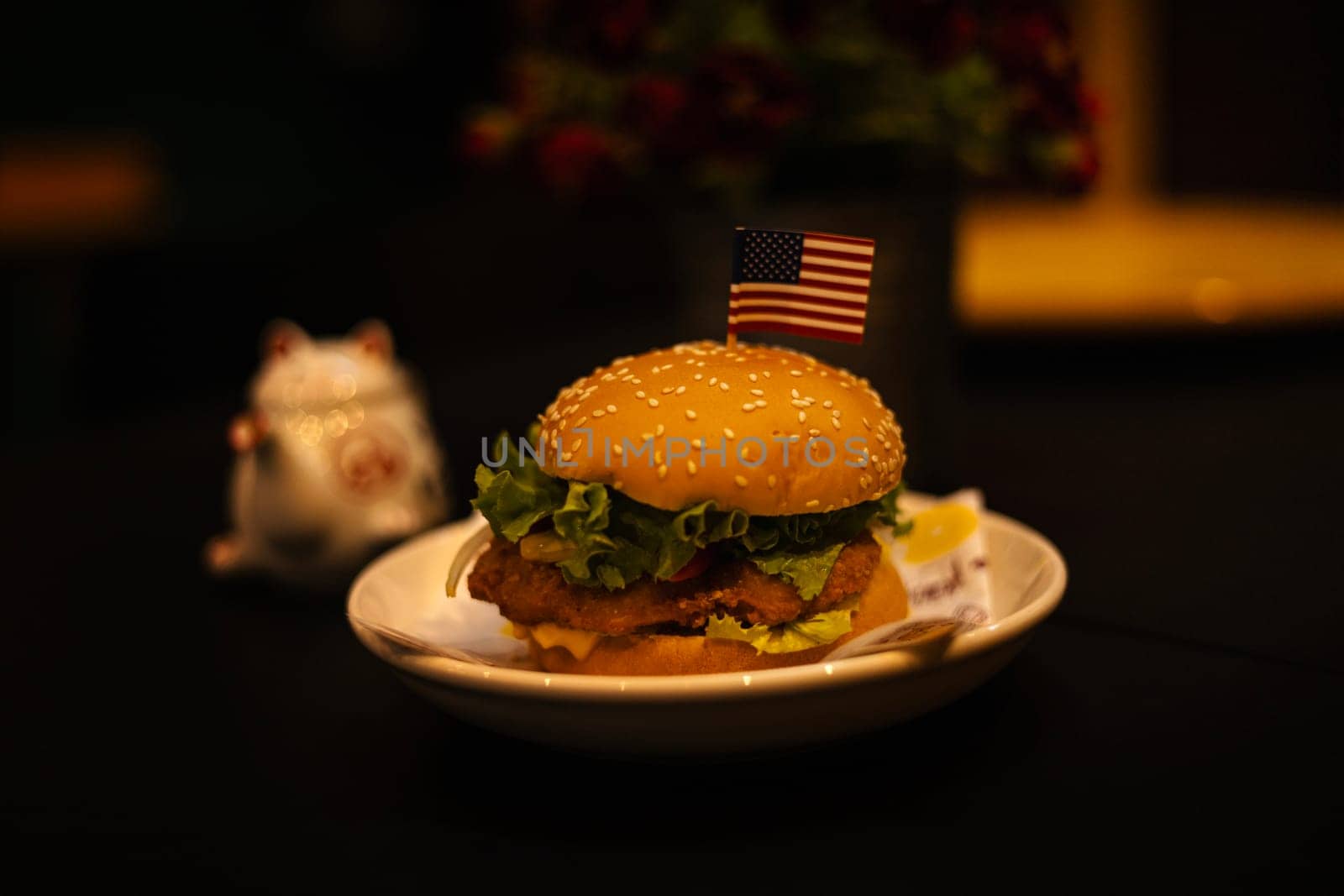 Fried chicken sandwich on a plate on dark background. Hamburger.
