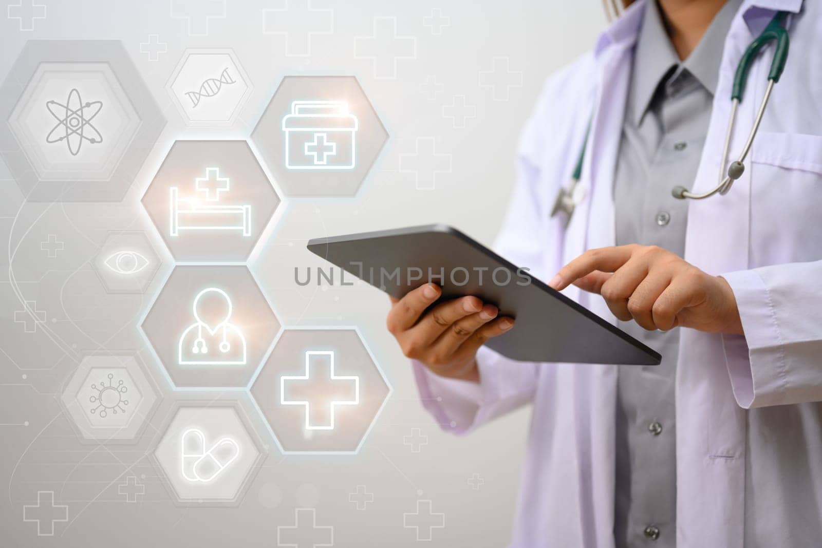 Female doctor using digital tablet on white background. Medical service and Health insurance concept.