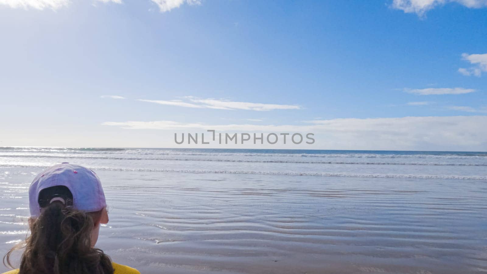 Little Girl Joyfully Running on Winter Beach by arinahabich