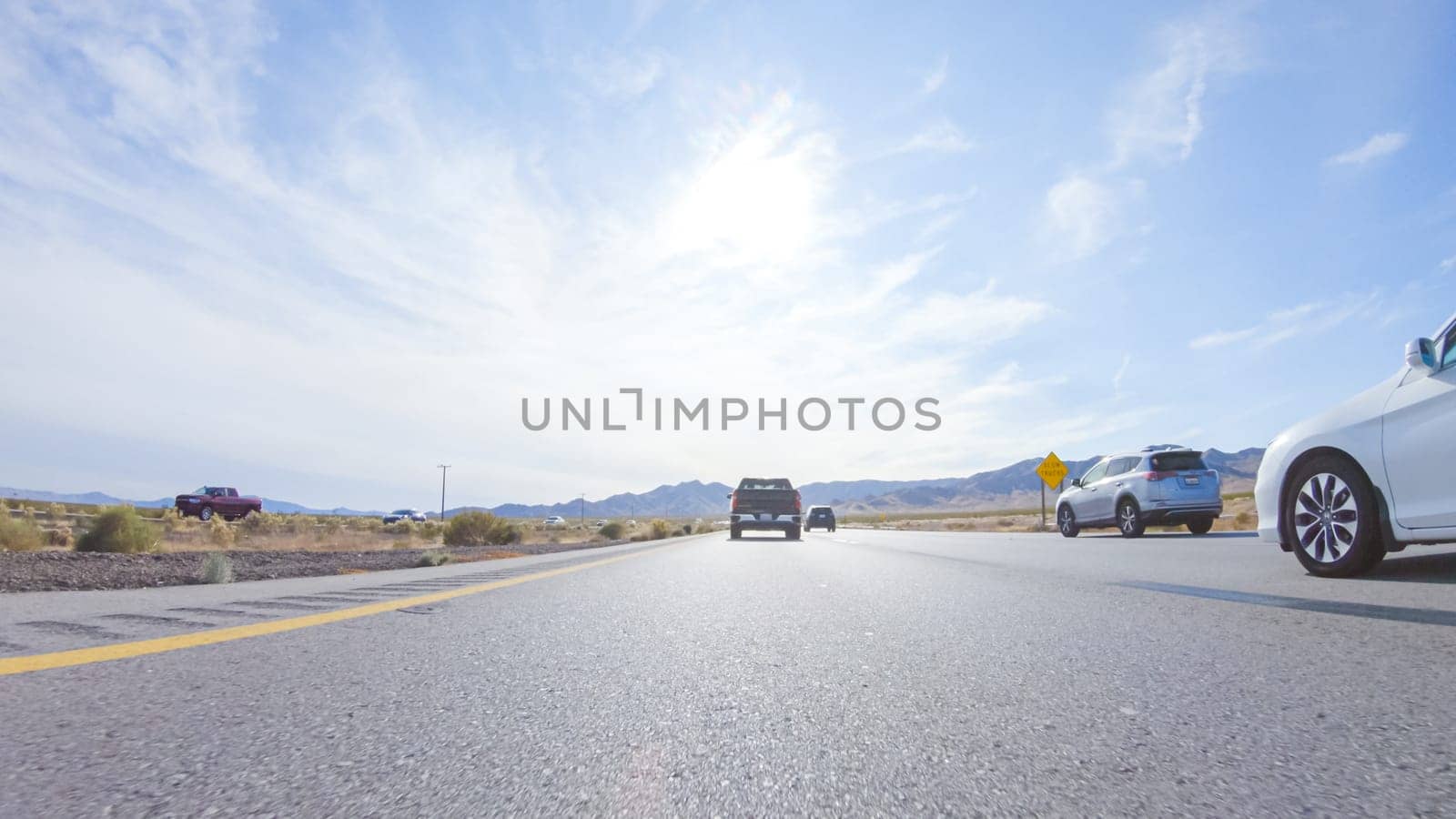 HWY 15, California, USA-December 3, 2022-Embarking on a road trip from Nevada to California, driving on Highway 15 during the day offers scenic views and an exciting journey between states.