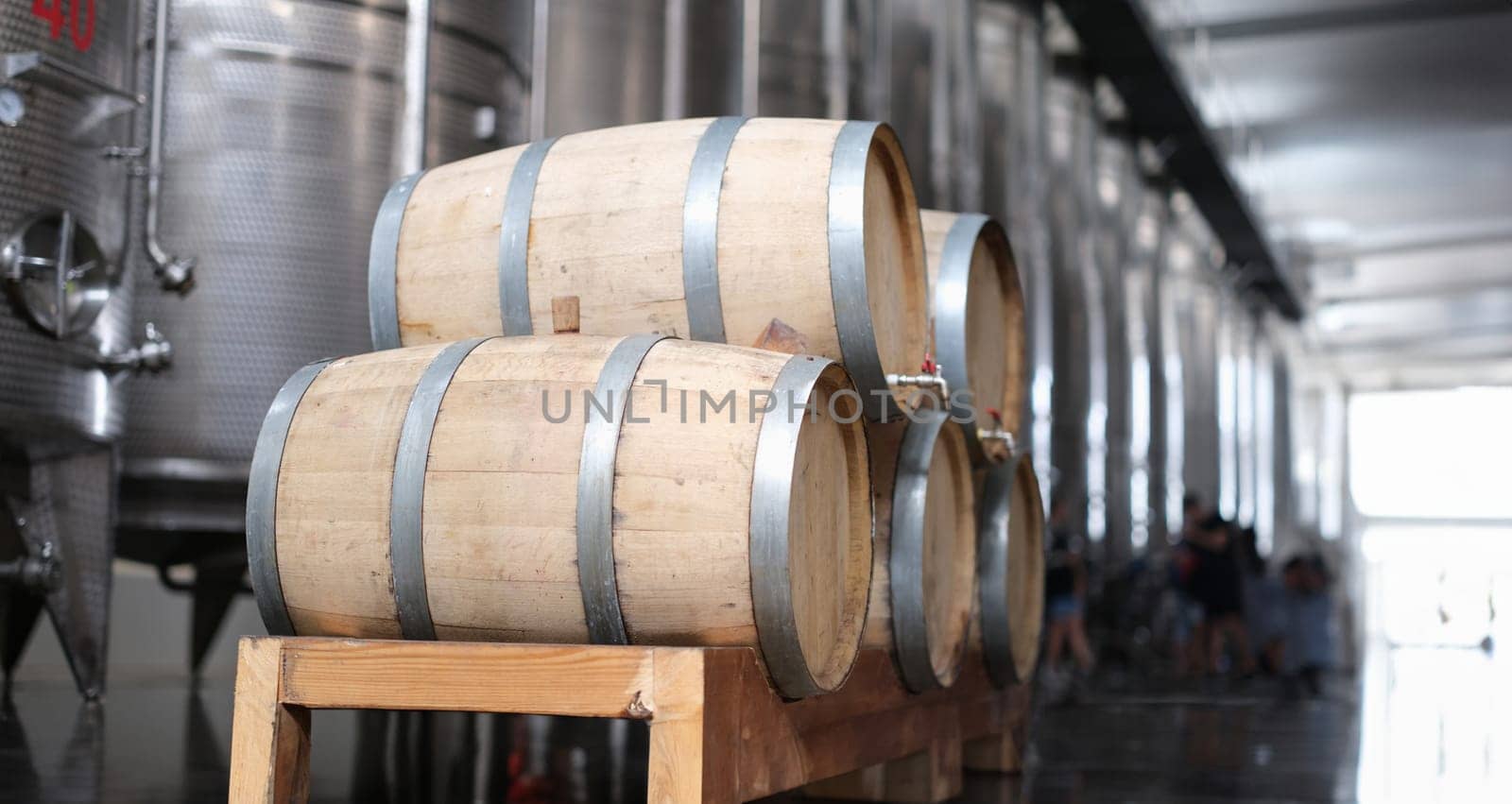 Wine production and modern wine tanks with wine barrels by kuprevich