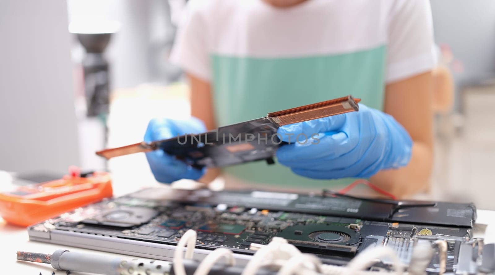 Technical engineer is working on computer motherboard. Repair of computer equipment concept