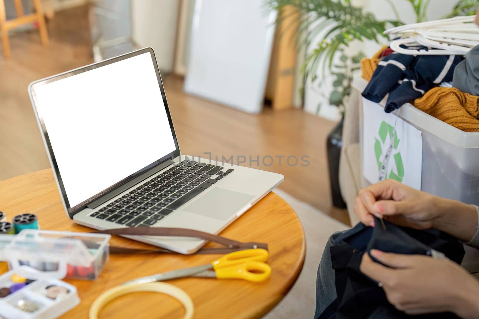 Young female with laptop at home on white blank screen for montage mockup display device in concept of lifestyle work at home .